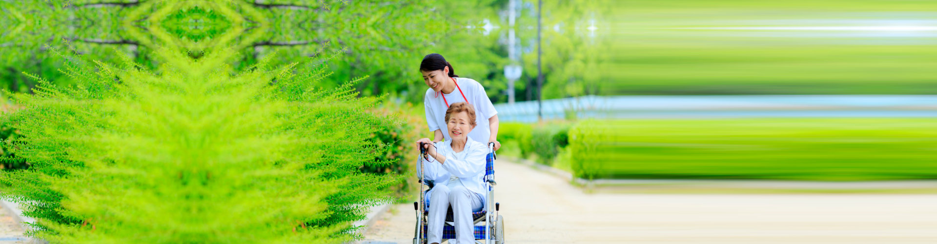 caregiver and senior woman strolling